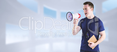 Composite image of male trainer yelling through the megaphone