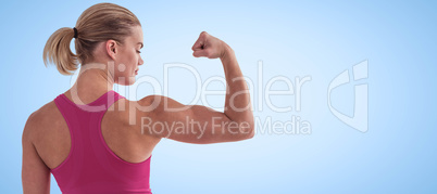 Composite image of rear view of muscular woman flexing muscles