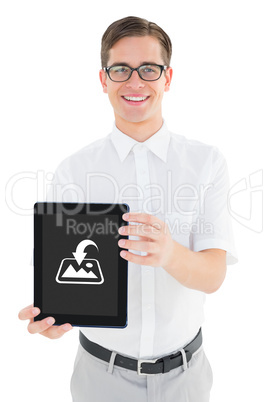 Composite image of geeky businessman showing his tablet pc