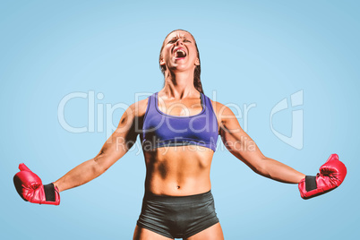 Composite image of winning fighter with arms outstretched