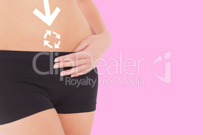 Composite image of closeup mid section of a fit woman in black s