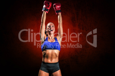 Composite image of winning fighter with arms raised