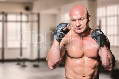 Composite image of portrait of fighter with gloves