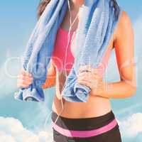 Composite image of mid section of healthy woman with towel aroun
