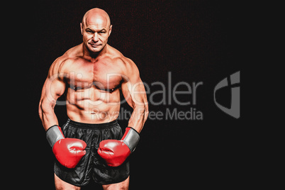 Composite image of portrait full length of bald boxer flexing mu