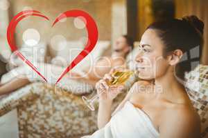 Composite image of woman enjoying her champagne