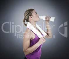 Composite image of muscular woman drinking water