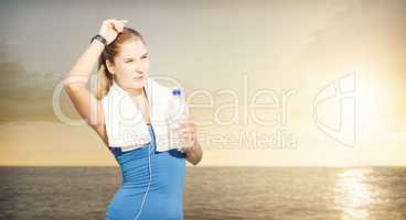 Composite image of fit woman with water