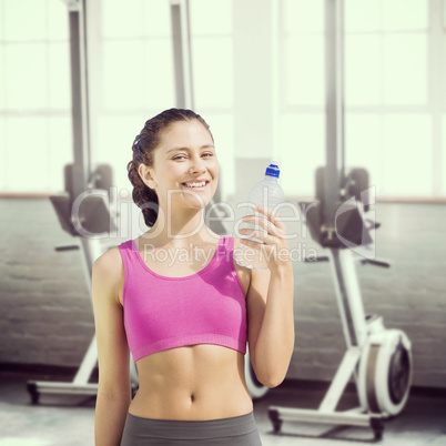 Composite image of fit woman with water