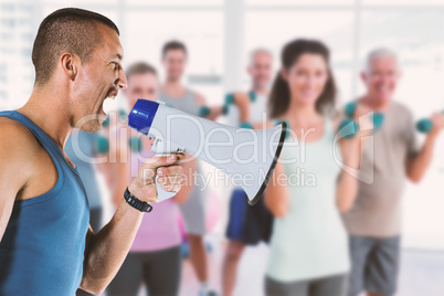 Composite image of angry male trainer yelling through megaphone