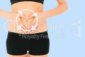 Composite image of closeup mid section of a fit woman in black s
