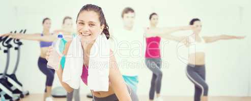 Composite image of fit woman with water