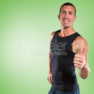 Composite image of happy athlete showing thumbs up