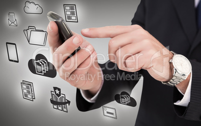 Composite image of businessman in glasses using his tablet pc