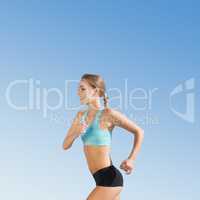 Composite image of fit woman jogging