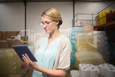 Composite image of university teacher using digital tablet