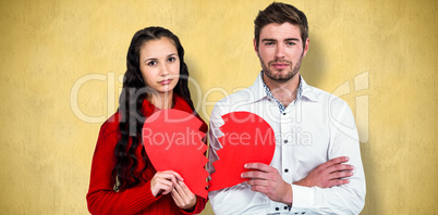 Composite image of couple holding heart halves