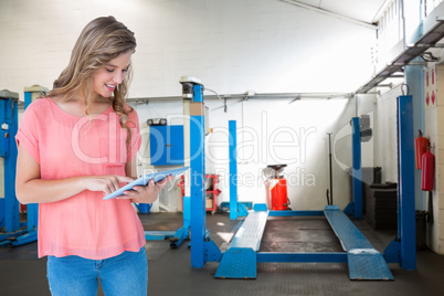 Composite image of hipster woman holding tablet pc