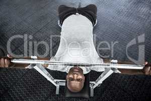 Composite image of fit man exercising with barbell