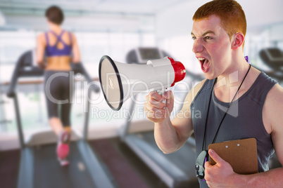 Composite image of angry personal trainer yelling through megaph