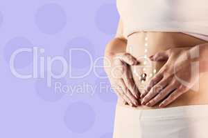 Composite image of slim woman touching her belly