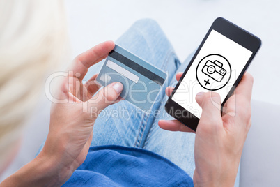 Composite image of woman doing online shopping with her mobile p