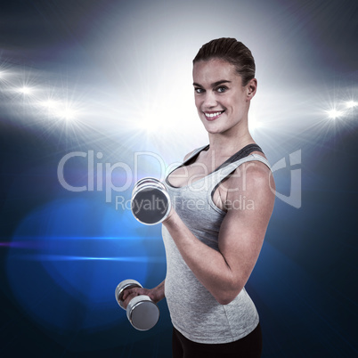 Composite image of  muscular woman working out with dumbbells