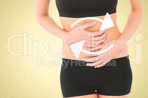 Composite image of mid section of a fit young woman with stomach