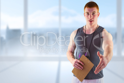 Composite image of welcoming personal trainer giving handshake