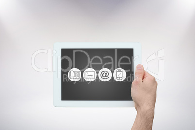 Composite image of hand holding tablet pc