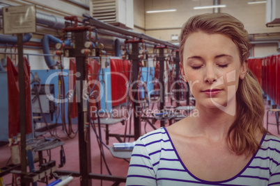 Composite image of happy woman with eyes closed