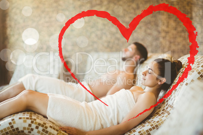 Composite image of man and woman lying down together