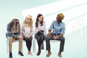 Composite image of smiling business people sitting on chair