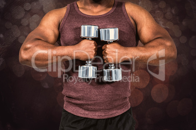 Composite image of fit man exercising with dumbbell