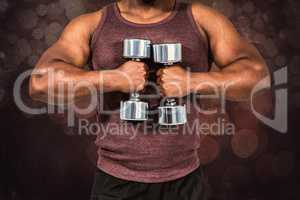 Composite image of fit man exercising with dumbbell