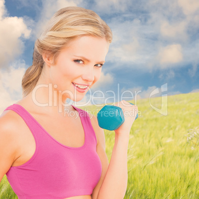 Composite image of happy fit woman