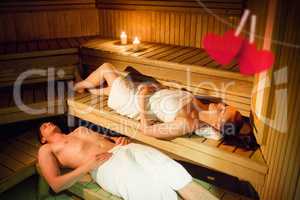 Composite image of couple relaxing in the sauna