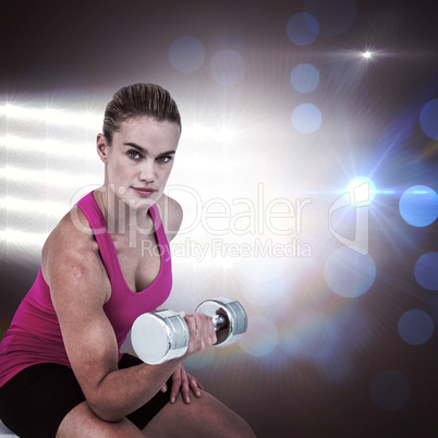 Composite image of muscular woman exercising with dumbbells