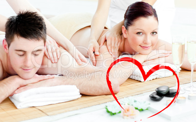 Composite image of attractive young couple enjoying a back massa