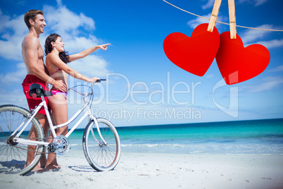 Composite image of happy couple going on a bike ride