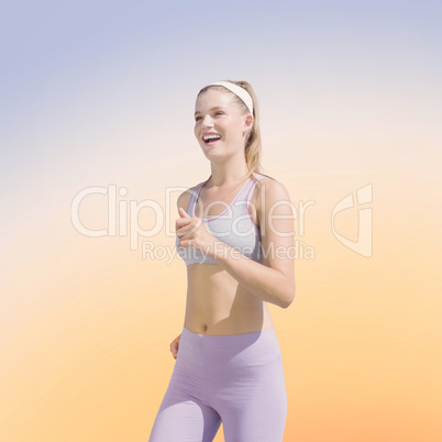 Composite image of sporty happy blonde jogging