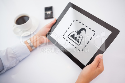 Composite image of man using tablet pc