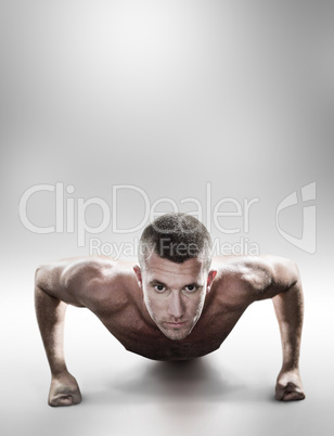 Composite image of portrait of confident shirtless man doing pus