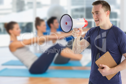 Composite image of male trainer yelling through the megaphone