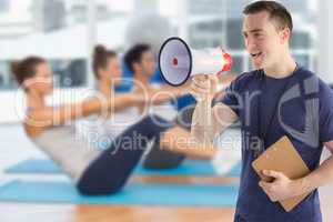 Composite image of male trainer yelling through the megaphone