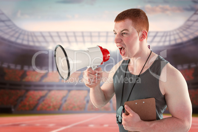 Composite image of angry personal trainer yelling through megaph