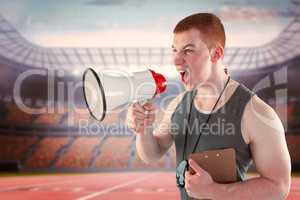 Composite image of angry personal trainer yelling through megaph