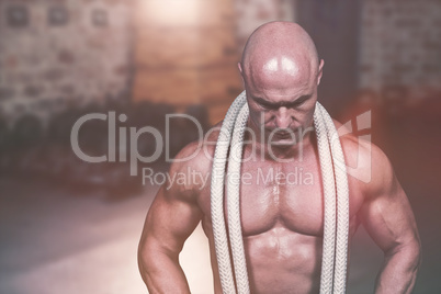 Composite image of bald man with rope around neck