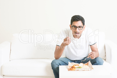 Lonely single man eating food alone