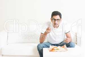 Lonely single man eating food alone